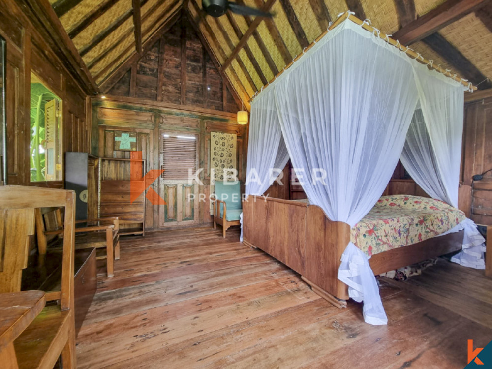 Traditional Four Bedrooms Closed Living Joglo with Rice Field View In Cemagi — image 4