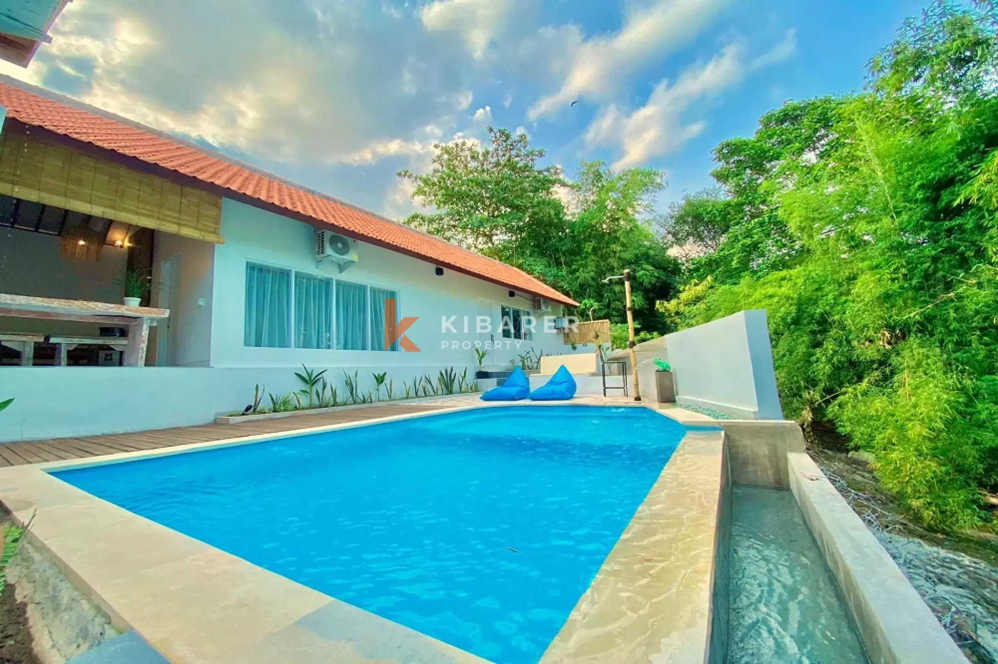 Three-Bedroom House with River View and Open Living Space in Canggu